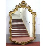 A XX Century George IV Style Gesso Wall Mirror, with shell 'C' scroll decoration, 118 x 70cm.