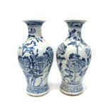 A Pair of Chinese Late XIX Century Pottery Baluster Vases, painted in blue with birds perched