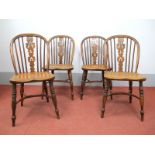 A Set of Four XIX Century Yew and Elm Windsor Chairs, with pierced splats, on turned legs with