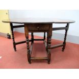 A Late XVII/Early XVIII Century Joined Oak Gateleg Table, with oval top and single drawer, on turned