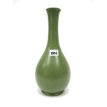 A Moorcroft Pottery Vase, circa 1930's, of baluster form, in matt green glaze, impressed marks,