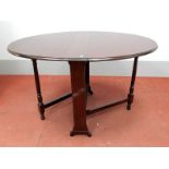 A Late XIX Century Sutherland Table, with drop leaves and turned legs, 74cm high.