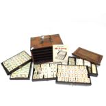 An Early XX Century Mah-Jong Set, contained in a five drawer hardwood carry case decorated with