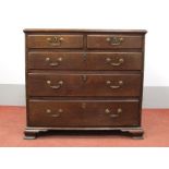 A Late XVIII Century Oak Chest, with two small and three long graduated drawers, having brass swan