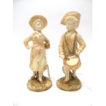 A Pair of Royal Worcester Porcelain Figures, in the Kate Greenway style, in blush ivory glaze,
