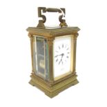 An Early XX Century French Repeater Carriage Clock, the brass case with Corinthian columns and