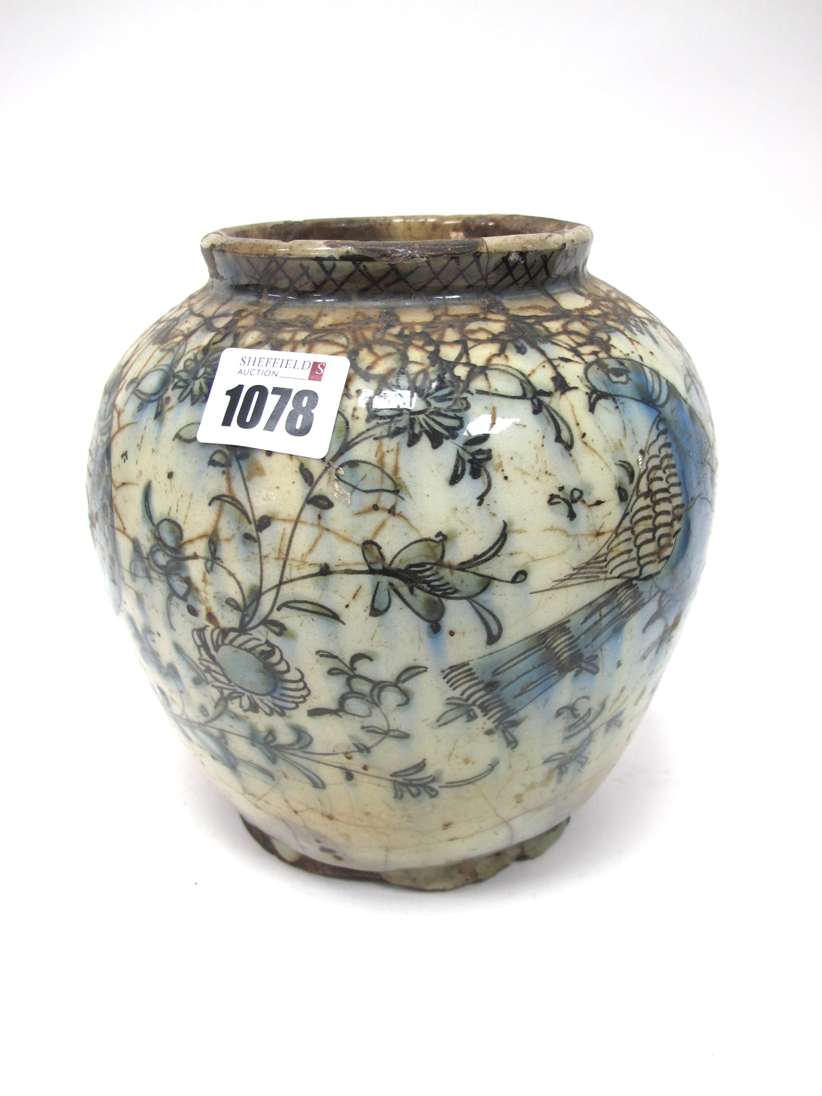 A Persian Style Pottery Vase, of ovoid form, the crackle ground painted in blue with birds amongst