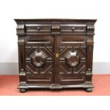 A XVII Century Joined Oak Moulded Front Cabinet, with single drawer over twin moulded front cupboard