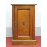 An Early XX Century Walnut Bedside Cupboard, with a low back, panelled door, on plinth base, 45cm