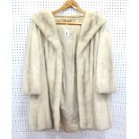 A Three-quarter Length Cream Mink Jacket, wrap over style with shawl collar, 87cm long.