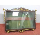 A Mahogany Wall Hanging Display Cabinet, the shaped top with gilt decoration, glazed door, the