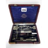 XIX Century Drawing Instruments Set, contained in a red leather case, bearing printed label, A.G.