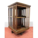 An Early XX Century Mahogany Revolving Bookcase, with square top, shelves with rail supports, 49cm