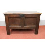 A Late XVII Century Oak Coffer, top with moulded edge over twin panelled front, on stile feet (