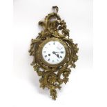 A XIX Century French Wall Clock, in gilt metal case, cast with flowers and scroll work, circular
