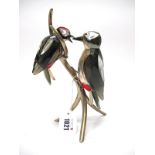 A Swarovski Crystal Paradise Bird Sculpture ' Woodpeckers - Black Diamond,' on metal branch, 21.