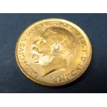 George V Gold Sovereign, 1914 'M', accompanied by Westminster C.O.A., (8.0g).