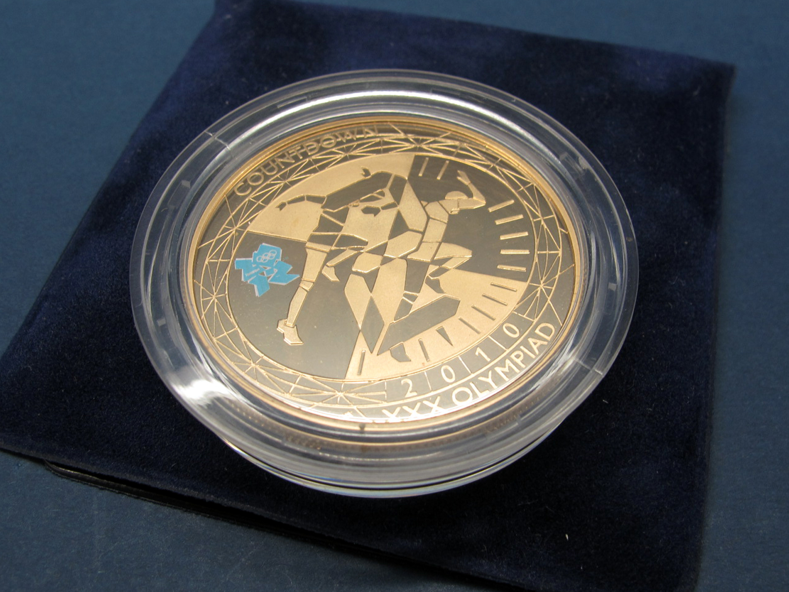 The Royal Mint Countdown to London 2012, 2010 Gold Proof Five Pounds Coin, .9167 AU, weight 39.