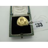 A Gent's Signet Ring, with "Festina Lente"? seal engraved oval panel, (finger size P½), (8 grams).