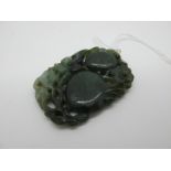 A Large Carved Green Hardstone Panel Pendant, of pierced foliate design, 5.8cm long.