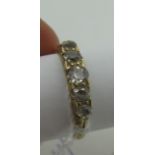 A Victorian Style Five Stone Diamond Ring, the graduated old cut stones inset within decorative