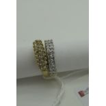 A Modern 18ct Gold Half Eternity Style Ring, of two row claw set design, between wide shoulders, (