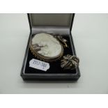 A Large Oval Shell Carved Cameo Brooch, collet set in a 9ct gold ropetwist mount, a delicate 9ct