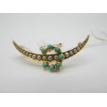 An Edwardian Turquoise and Pearl Set Crescent Brooch, the turquoise collet set on knife edge