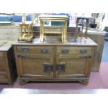 An Arts & Crafts Oak Sideboard, with low back, twin drawers, period oxidized copper strapwork,