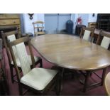 Ercol Oval Topped Dining Table, with pull-out centre leaf on bulbous pedestal and cruciform base,