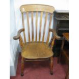 A XIX Century Farmhouse Smokers Armchair, with shaped top rail, slatted back, turned supports and '