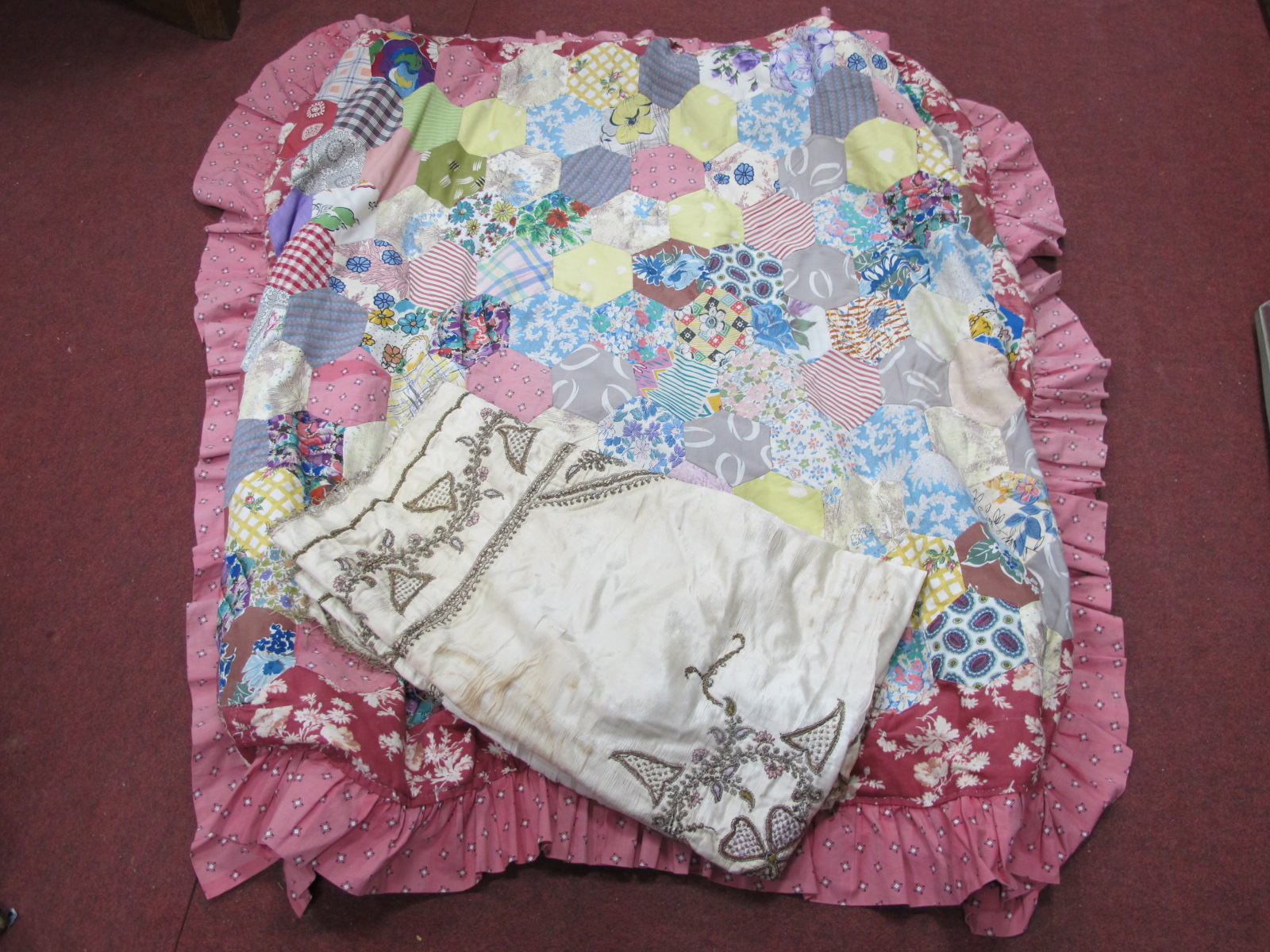 A Patchwork Quilt for a Cot, silk table cloth with symmetrical decoration in braid, approximately