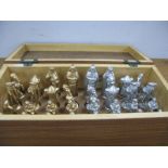 A Chess Set in Wooden Box, all figures present made of aluminium in gold and silver sets.