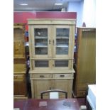 An Early XX Century Pine Kitchen Cabinet, with stepped pediments, twin glazed doors over small