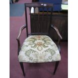 An Early XX Century Mahogany Salon Chair, with rail back, curved arms, tapering legs and spade