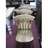 A Set of Four Pine Farmhouse Kitchen Chairs, with slatted backs on turned splayed legs.