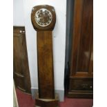 An Art Deco Walnut Cased Grandmother Clock, with tapering trunk, angular base, Westminster chime