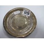 A White Metal Dish, with coin inset to centre, 11cm diameter.