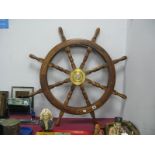 A Wooden Ships Wheel, with eight turned handles and brass centre, 93cm overall width.