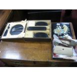 A Ladies Cased Dressing Table Set, black lacquer box, Indian slippers.