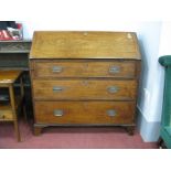 An XVIII Century Mahogany Bureau, with slope front, pigeon hole fitted interior, over three