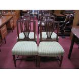 A Set of Four Late XIX Century Mahogany Chairs, the shaped top rail with swag decoration, rail