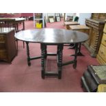 A XVII Century Oak Gate leg Table, with drop leaves to oval top, on barley twist legs 106.5 x 138.