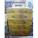 A 1920's Walnut Chest of Drawers, the top with a moulded edge over five long drawers, 99cm wide.