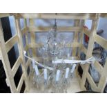 A Mid XX Century Clear Glass Hanging Chandelier, with twelve sconces, the upper section with