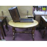 A XIX Century Mahogany Oval Topped Table, on turned legs and stretcher. Sewing machine case. (2)