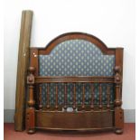 A XIX Century Mahogany Bed, the arched headboard with upholstered panel, foot of the bed with turned