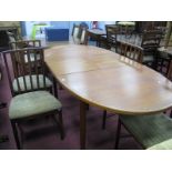 A McIntosh Teak Oval Topped Extending Dining Table, with central leaf, 196 wide overall, together