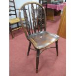 A XIX Century Yew-Elm Chair, with a hooped pierced splats with draught centres, on turned legs,
