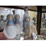 Four Nao Figurines of Girls.